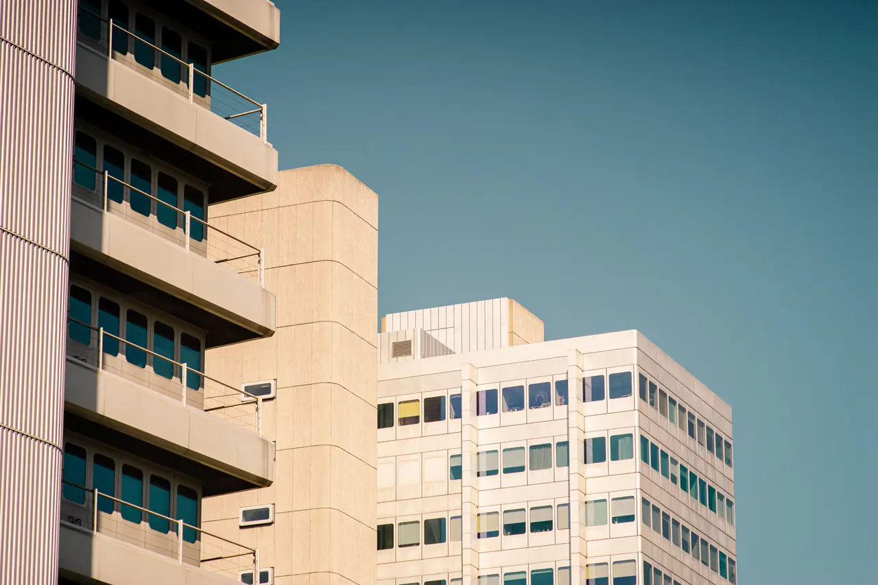 Civic buildings beneath a clear blue sky
